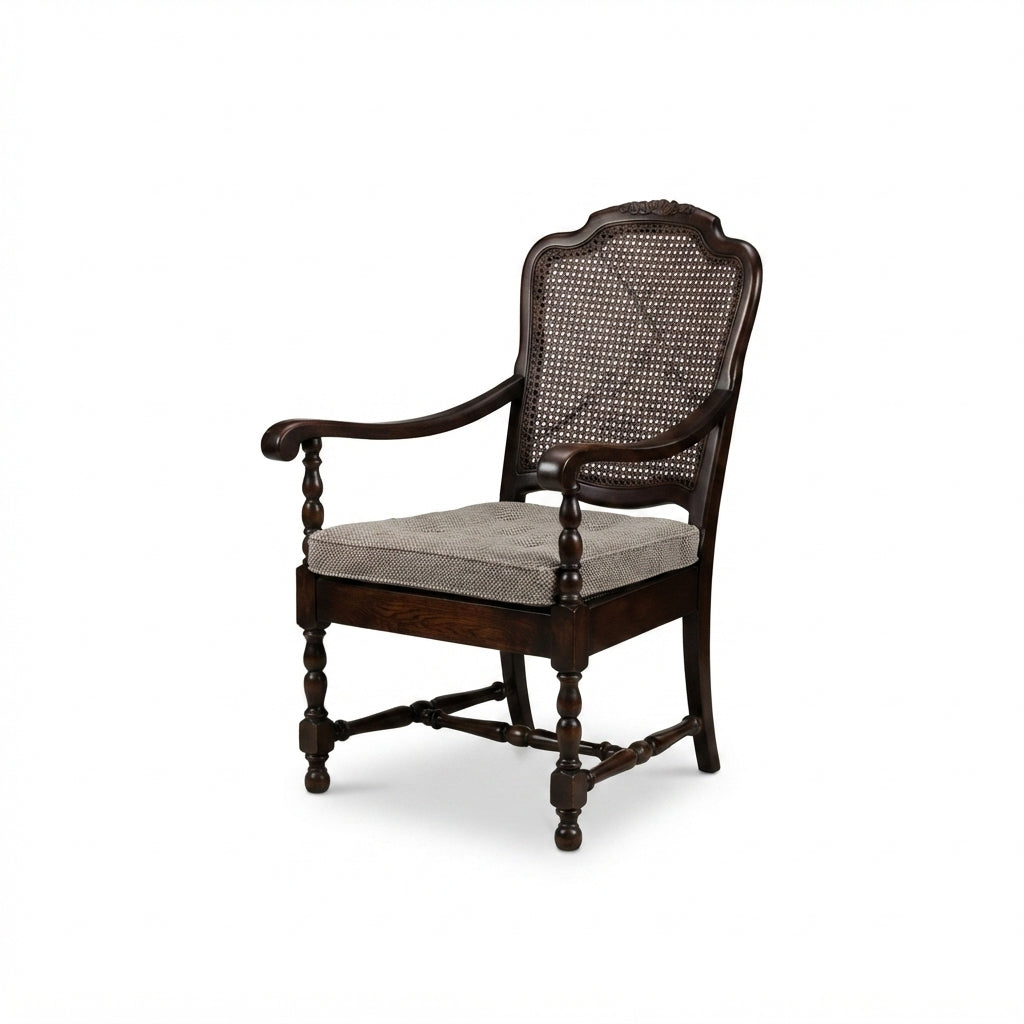 Dark wood armchair with woven cane back and seat