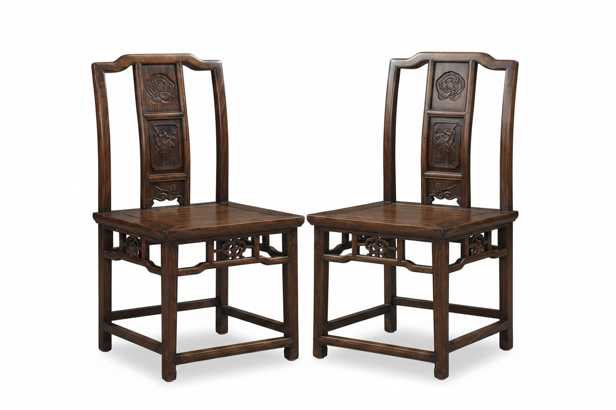 Two antique Chinese carved wood chairs on white background
