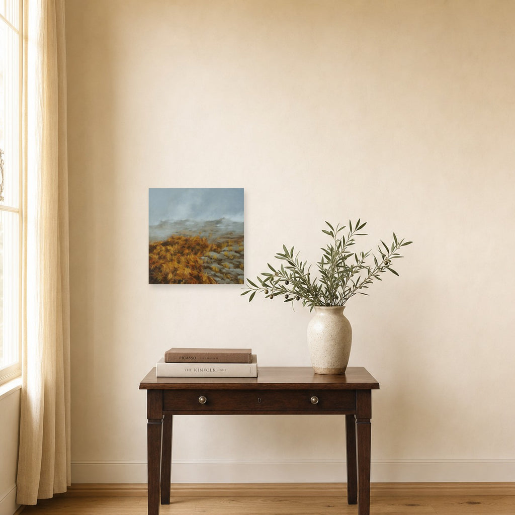 Incoming Fog by Freya Grand shown to scale on a wall above a small wooden side table