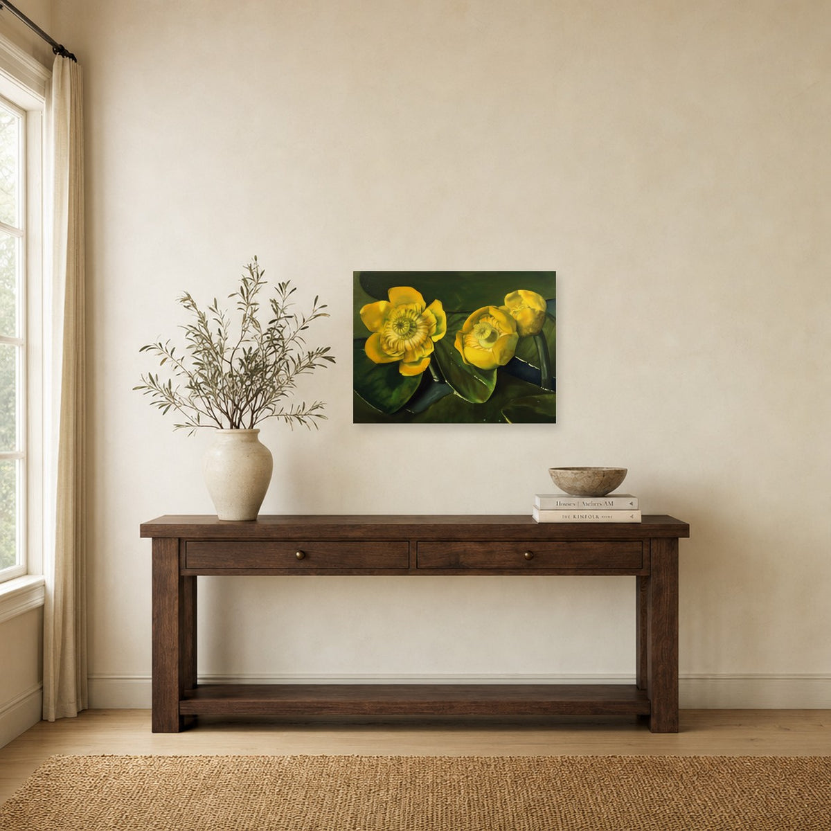 Yellow Lilies by Rebecca Ford shown to scale on a wall above a wooden console table